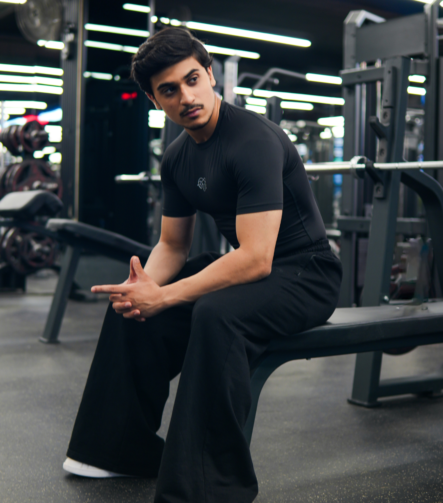 Young Goat black compression t-shirt lifestyle — men sitting in gym, India