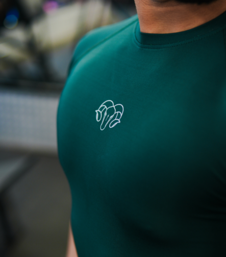Young Goat green compression t-shirt YNG chest logo close-up — men's gym wear India