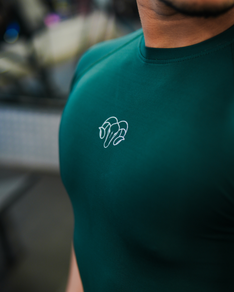 Young Goat green compression t-shirt YNG chest logo close-up — men's gym wear India