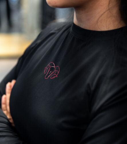 Young Goat women's black long sleeve crop compression top chest logo arms crossed gym
