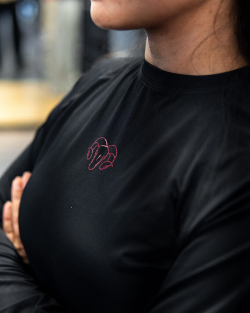 Young Goat women's black long sleeve crop compression top chest logo arms crossed gym